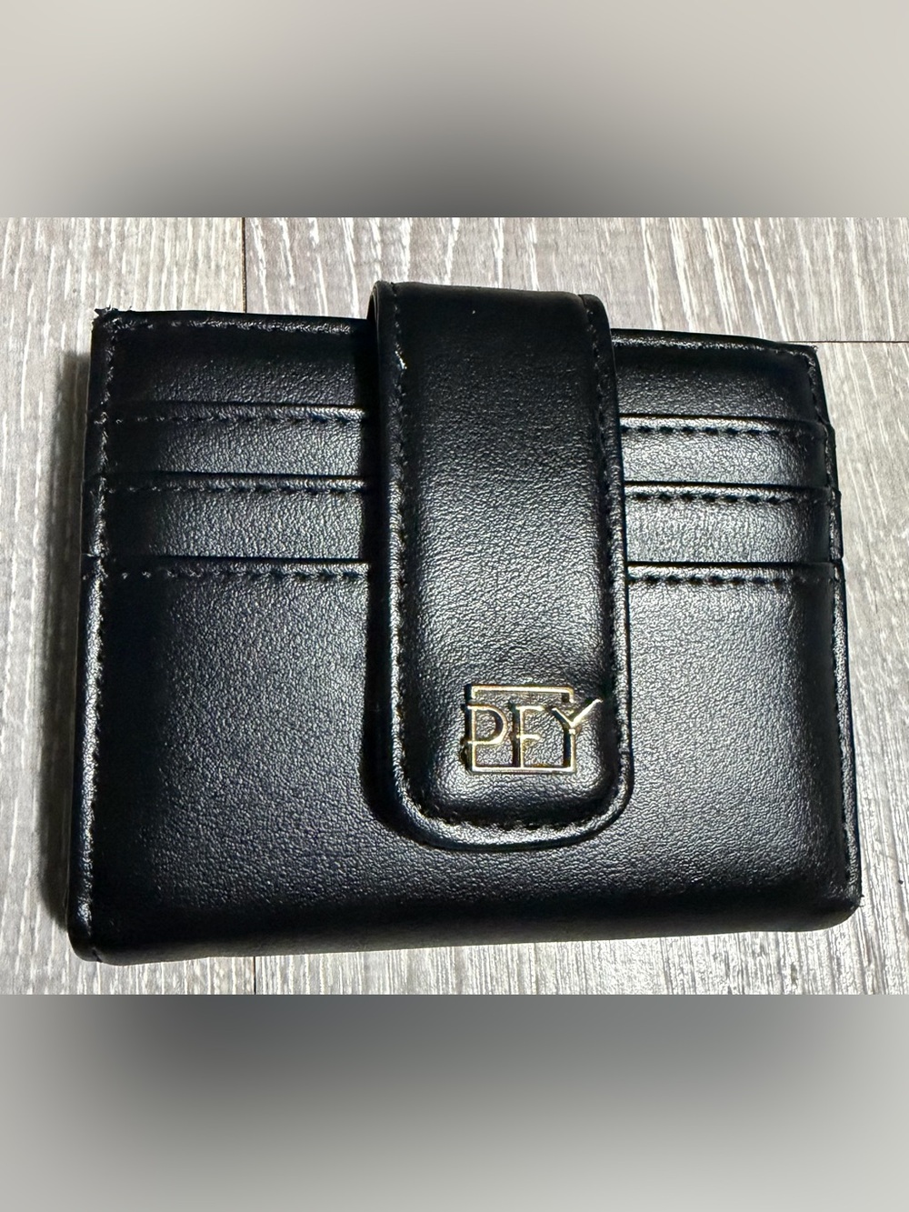 Compact Black Leather Card Wallet with Gold Accent